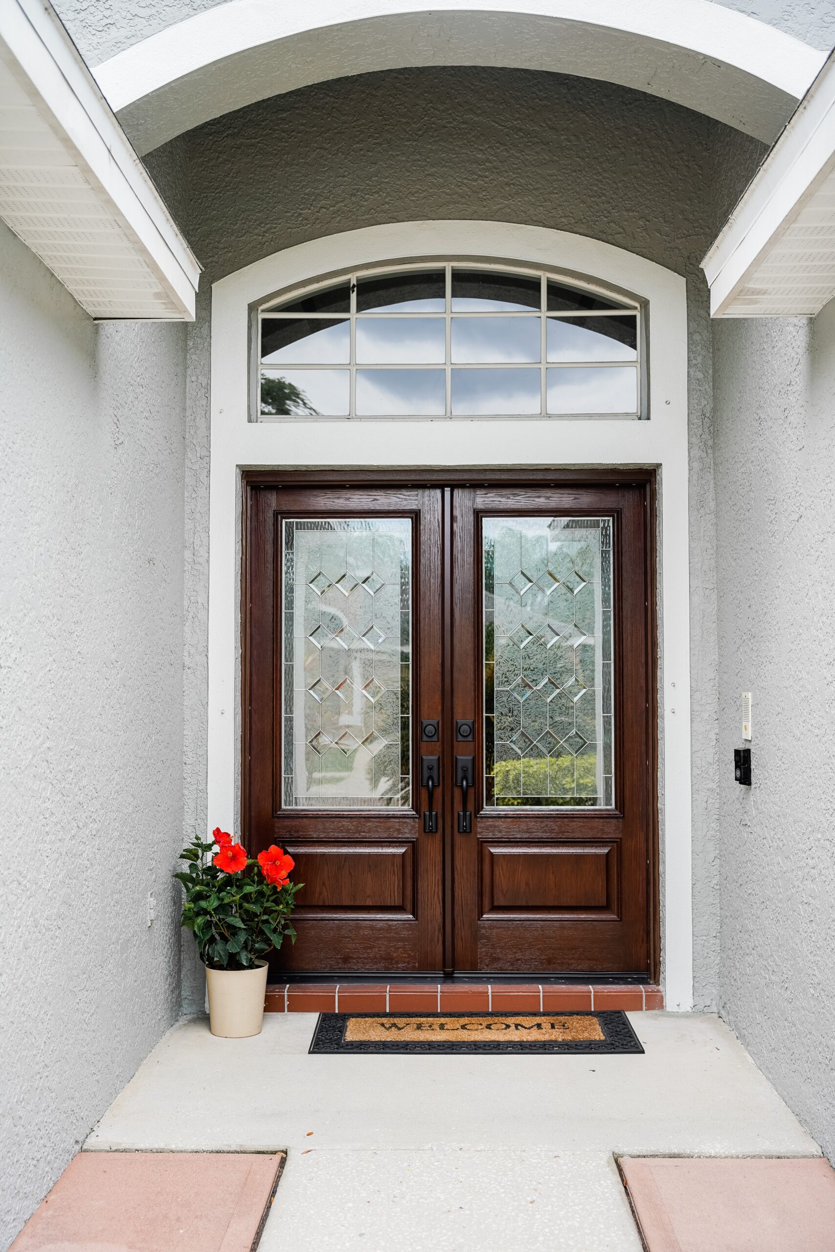 ProVia Aeris luxury wood-clad windows in Bronze installed on a stone exterior home by Speaks Custom Window & Sunrooms in Charlotte, NC.