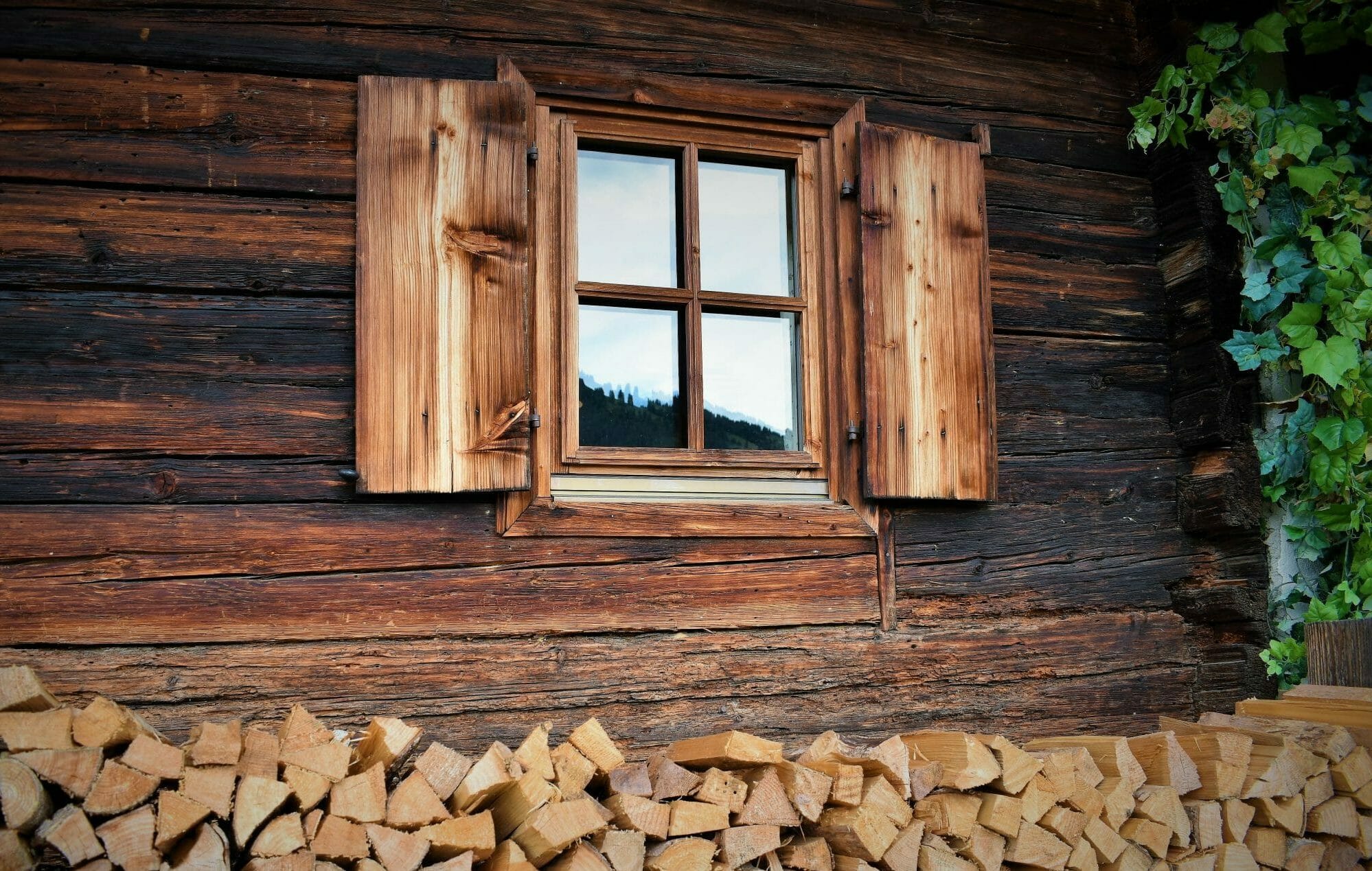 Historical Windows in Mooresville - NC being measured as an installer checks original wood trim