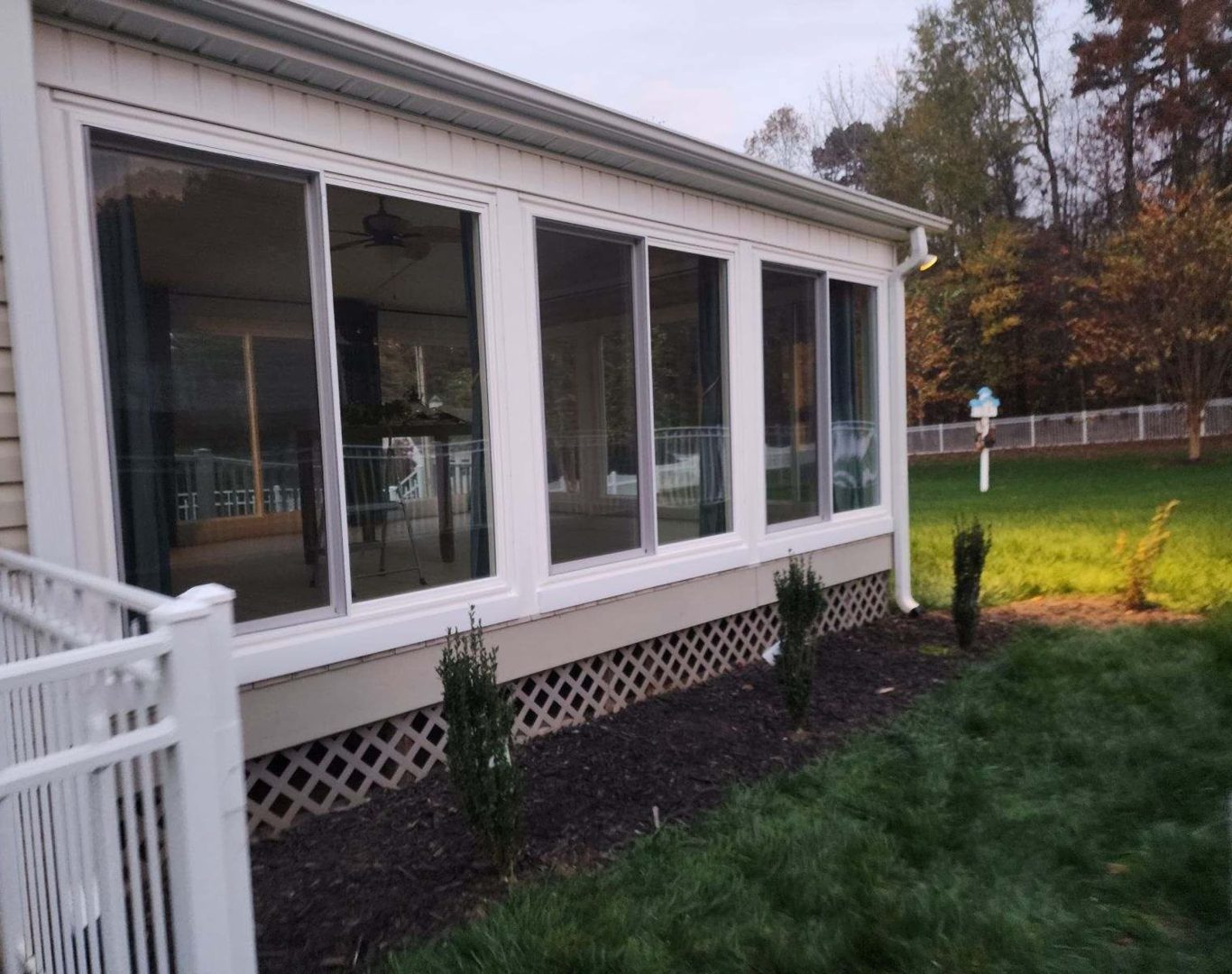 Sunroom with large white sliders