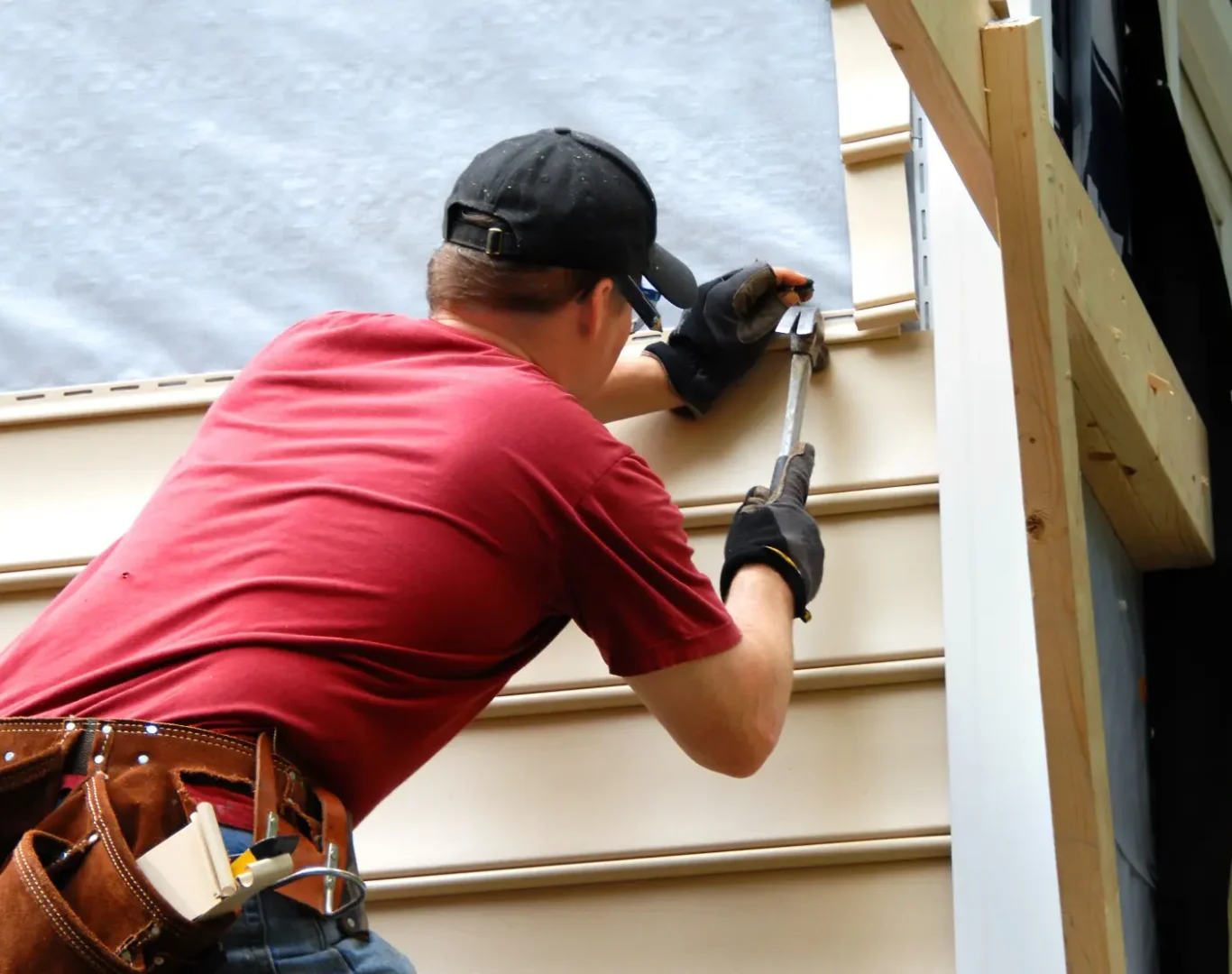 Siding contractor in Salisbury, NC installing durable exterior siding to protect and improve a residential home